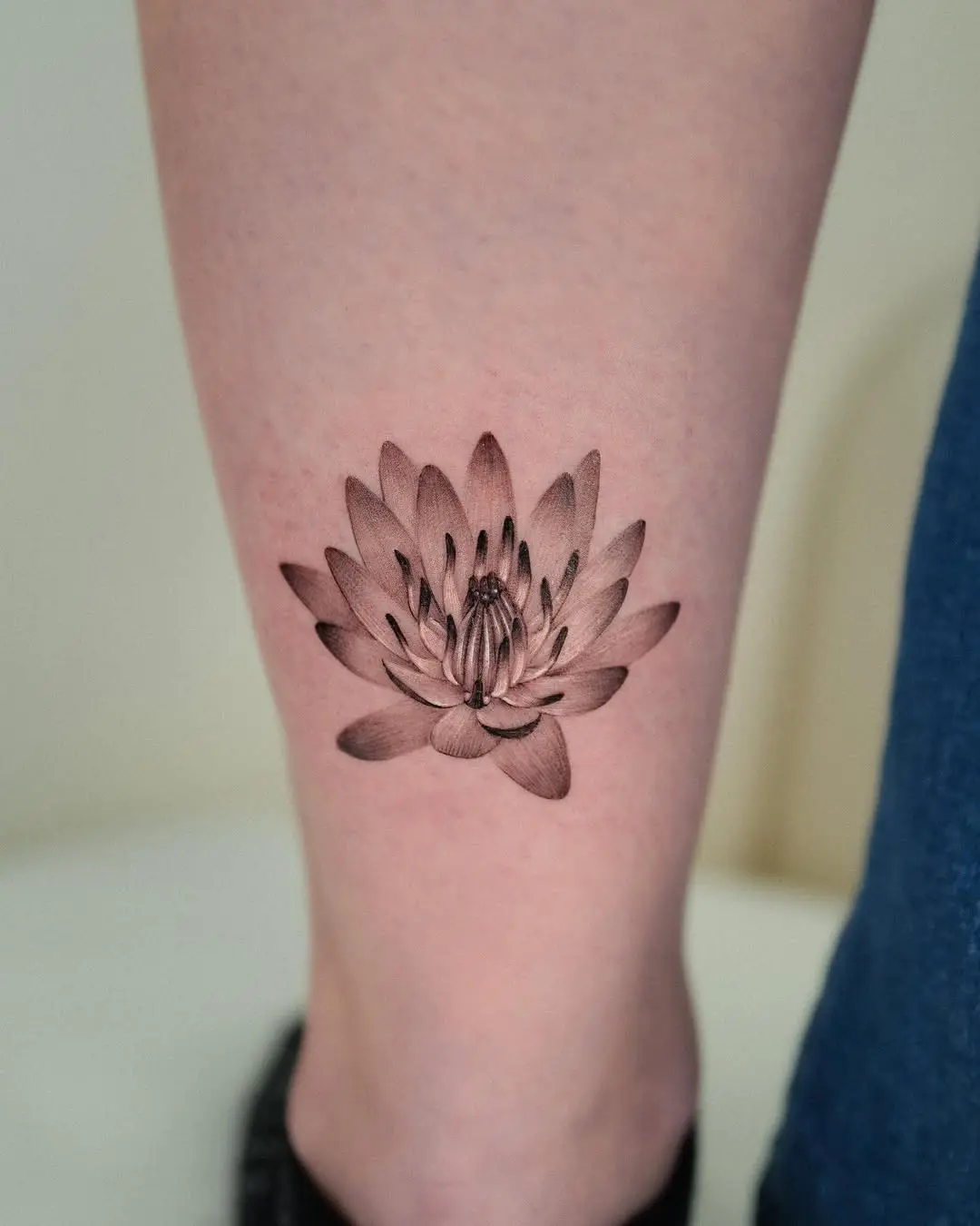 Elegant black and gray water lily tattoo