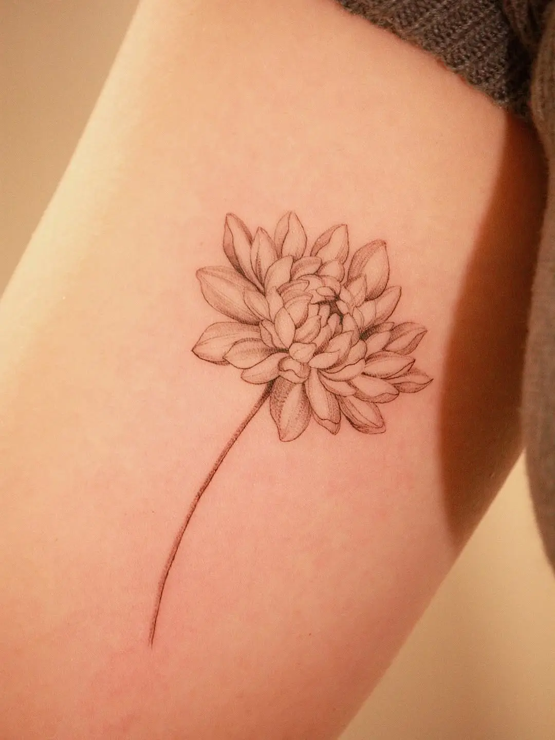 Elegant water lily tattoo in soft shades