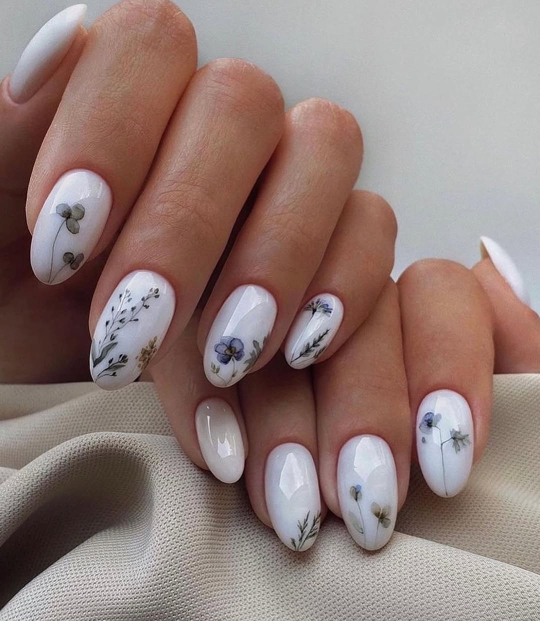 Delicate floral designs for elegant wedding nails.
