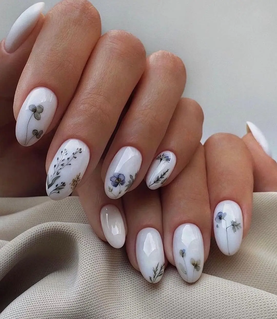 Delicate floral designs for elegant wedding nails.