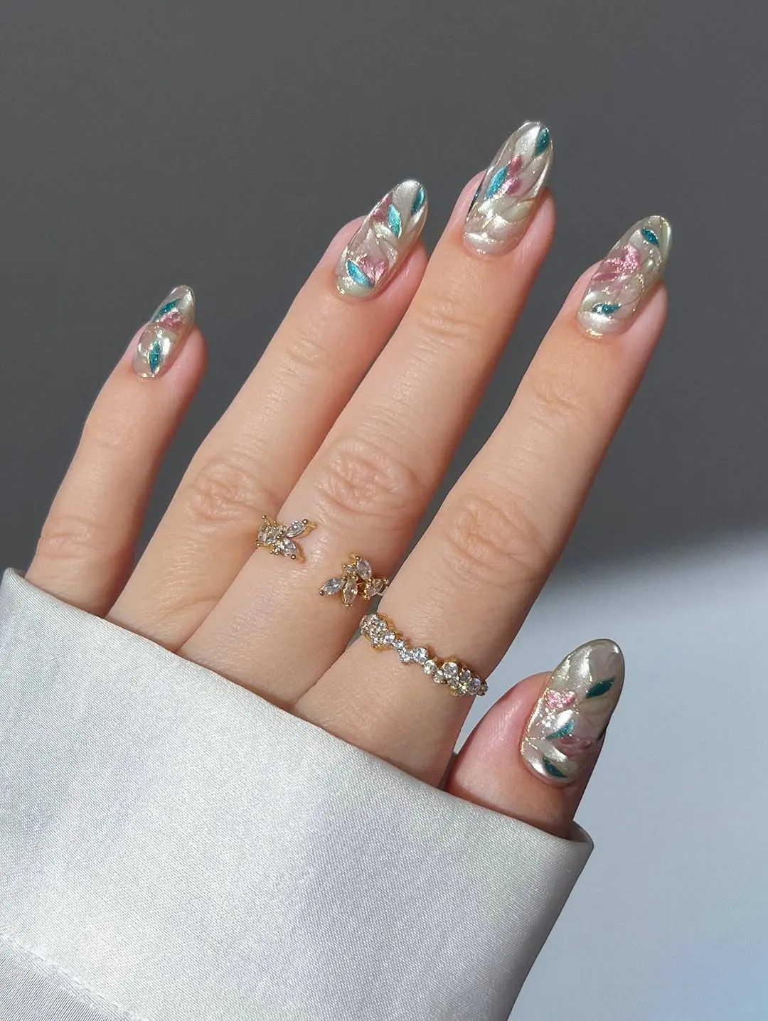 Elegant wedding nails with colorful shimmer effects