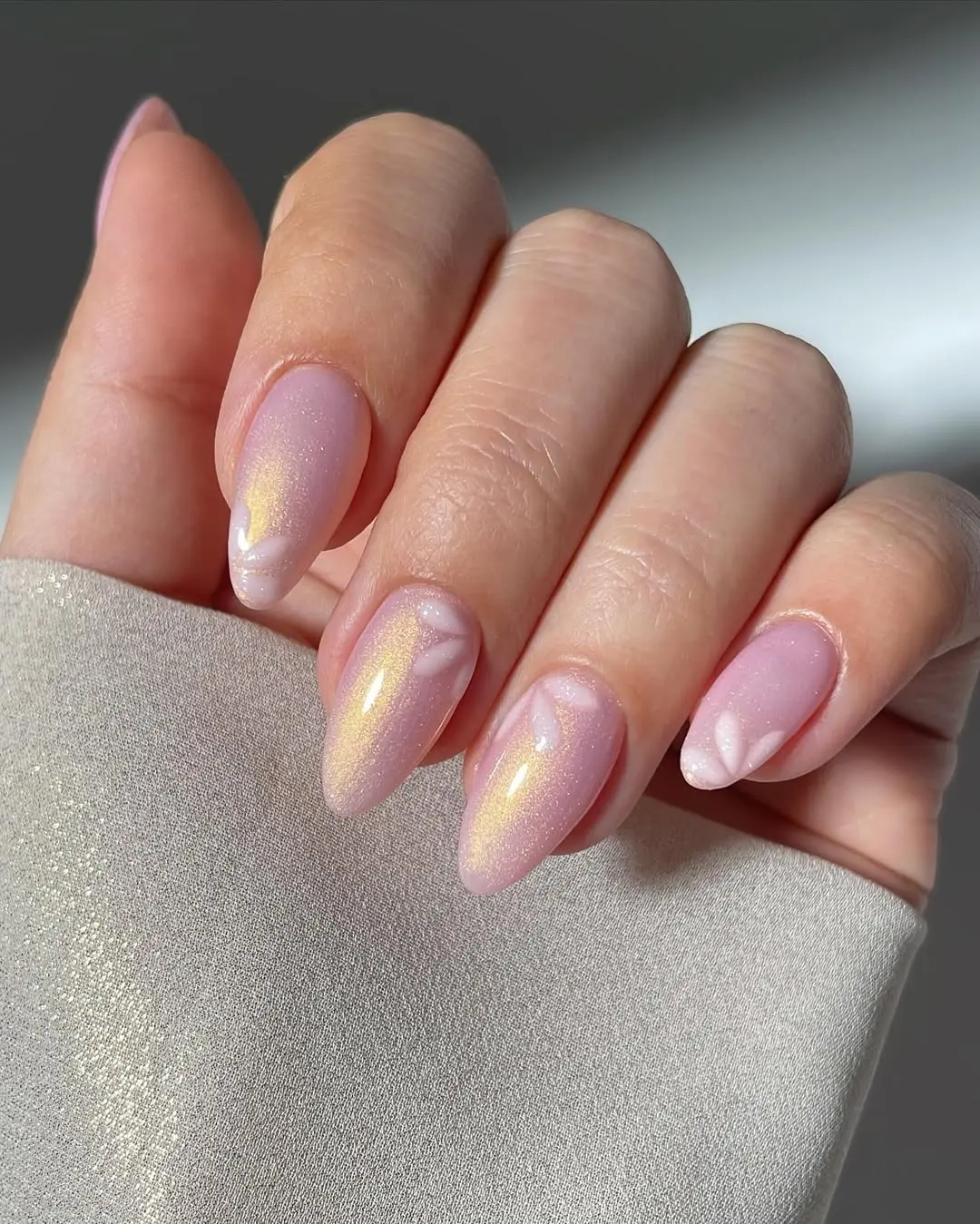 Elegant pink nails with soft glowing accents