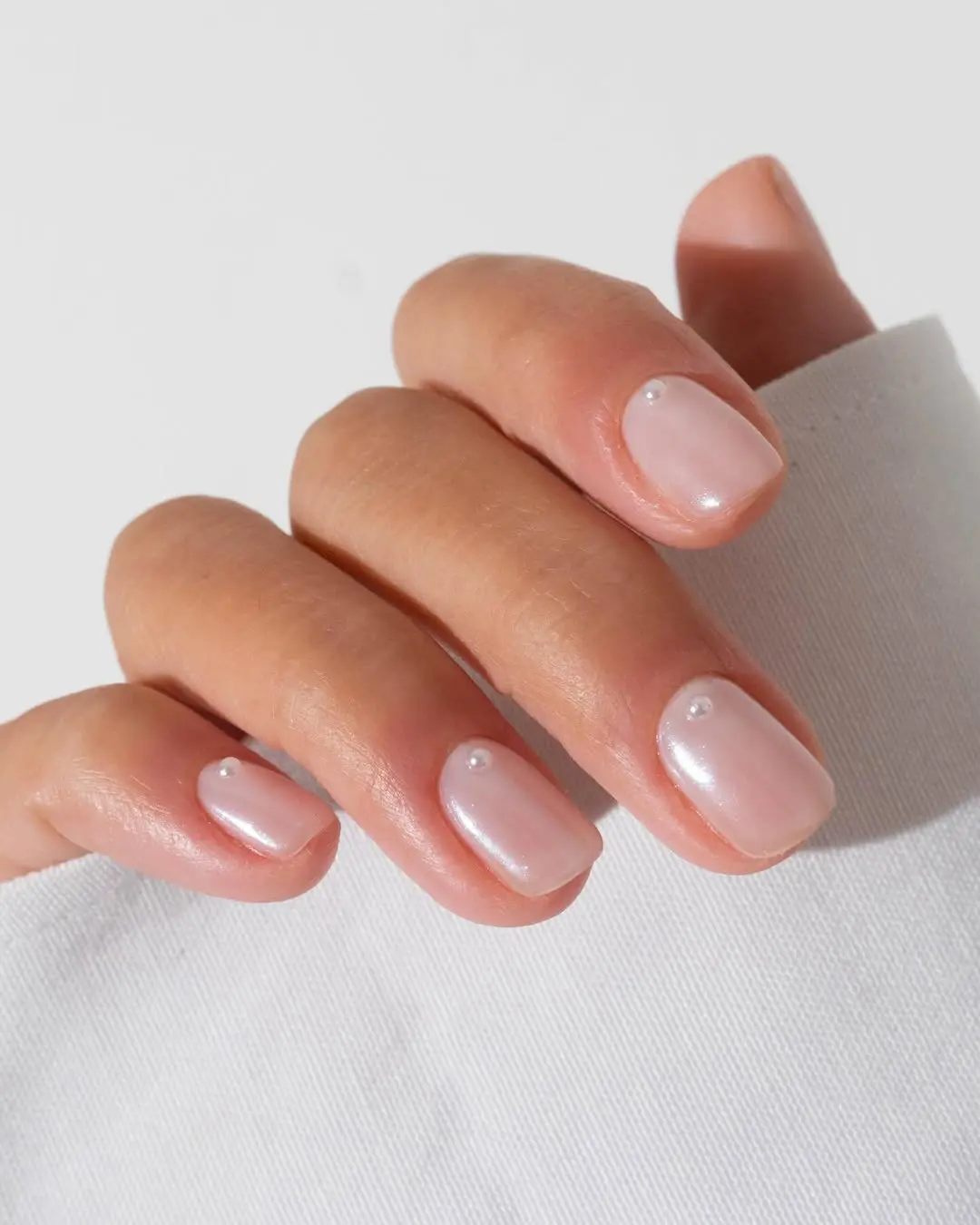Elegant wedding nails with soft pink tones