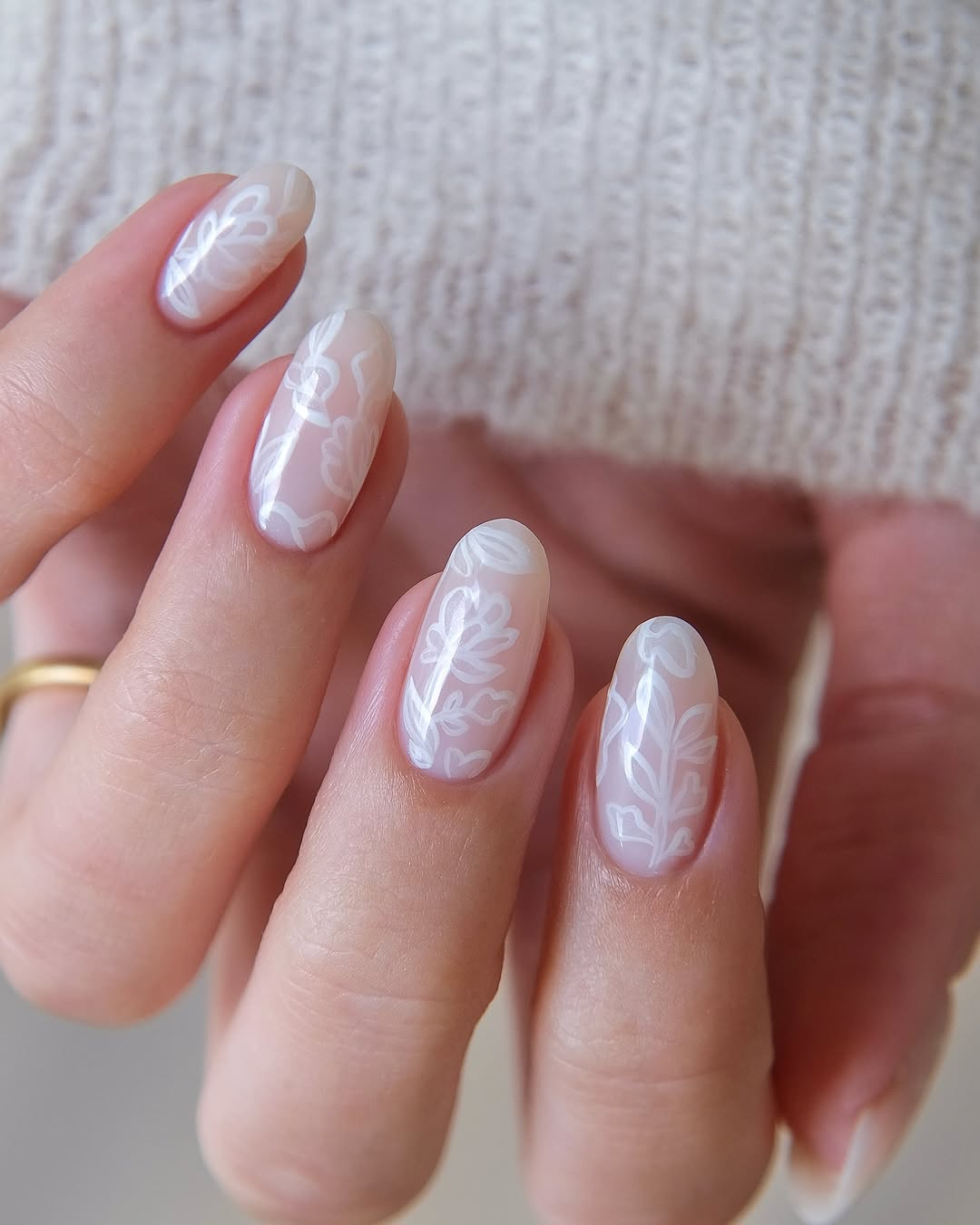 Elegant sheer nails with delicate floral designs