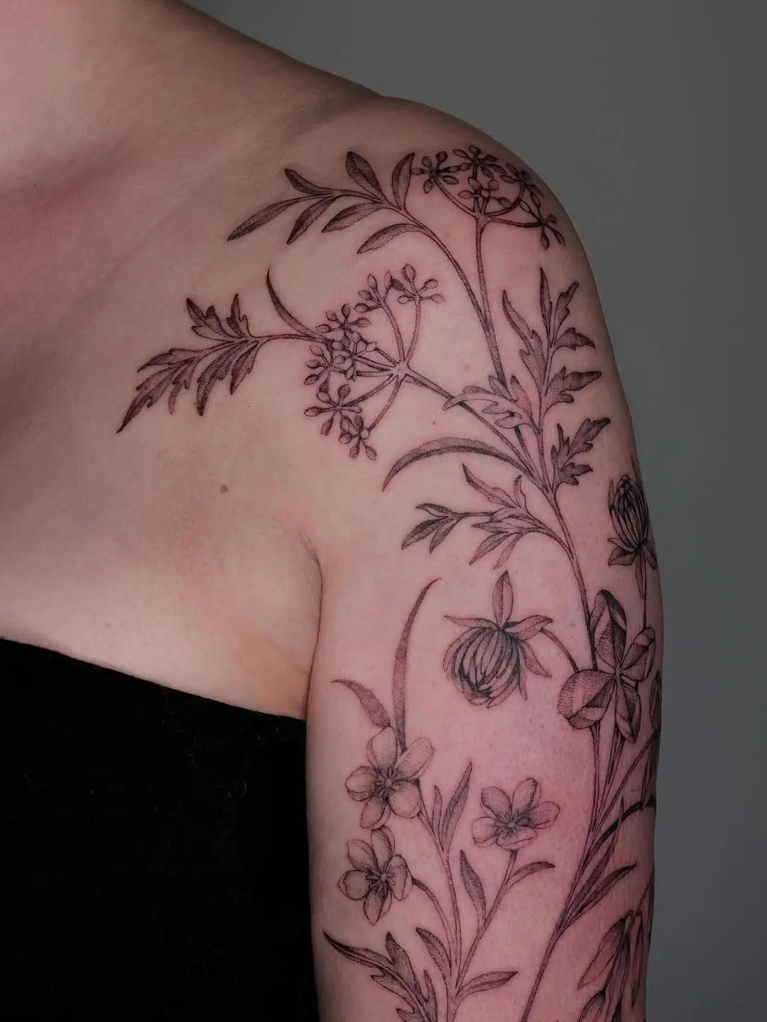Intricate wildflower design on the arm