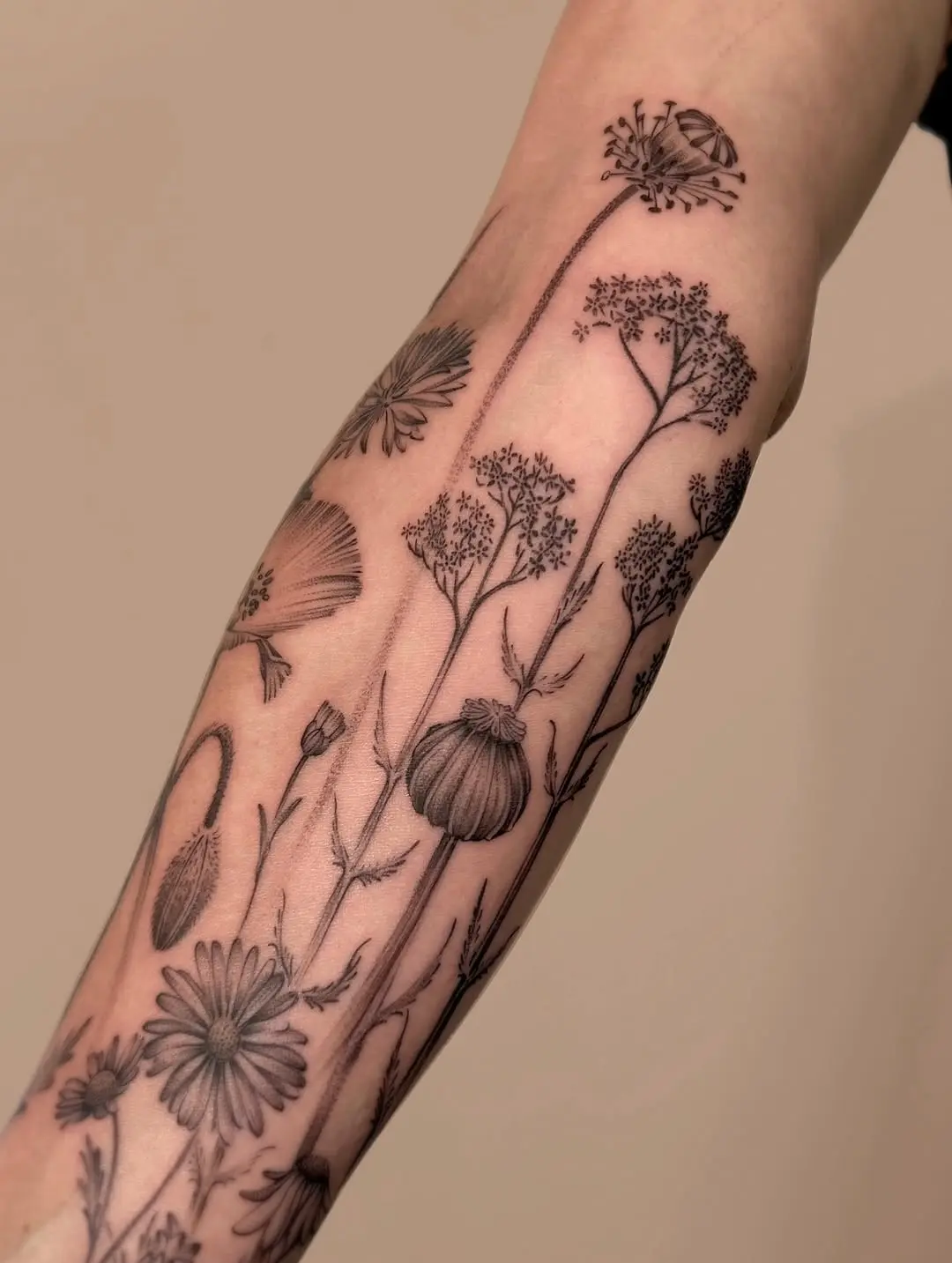 Beautiful wildflower tattoo design on arm