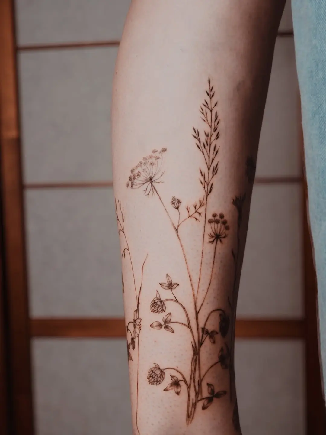 Elegant Wildflower Tattoo on Forearm
