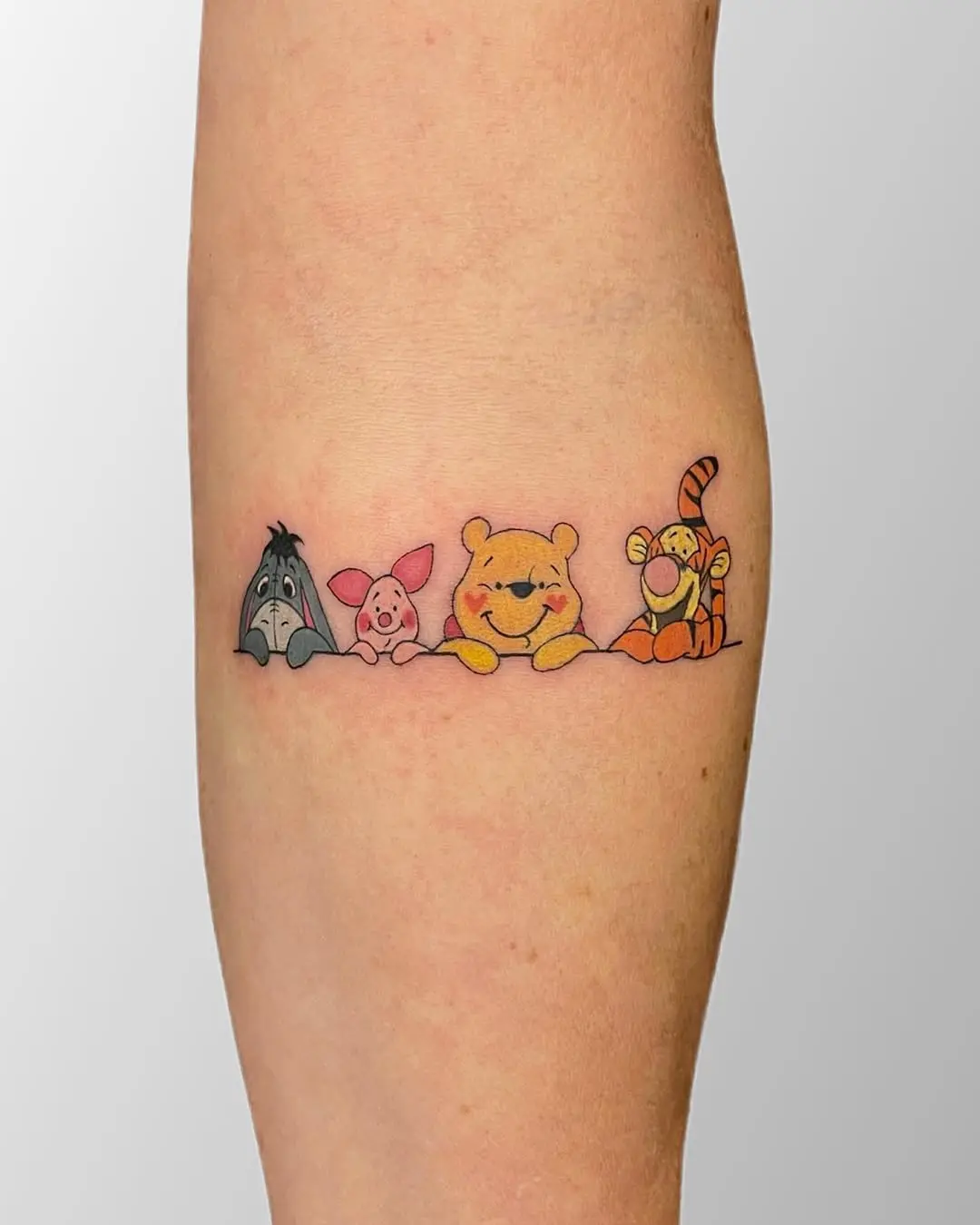 Charming Winnie the Pooh Character Tattoo Design