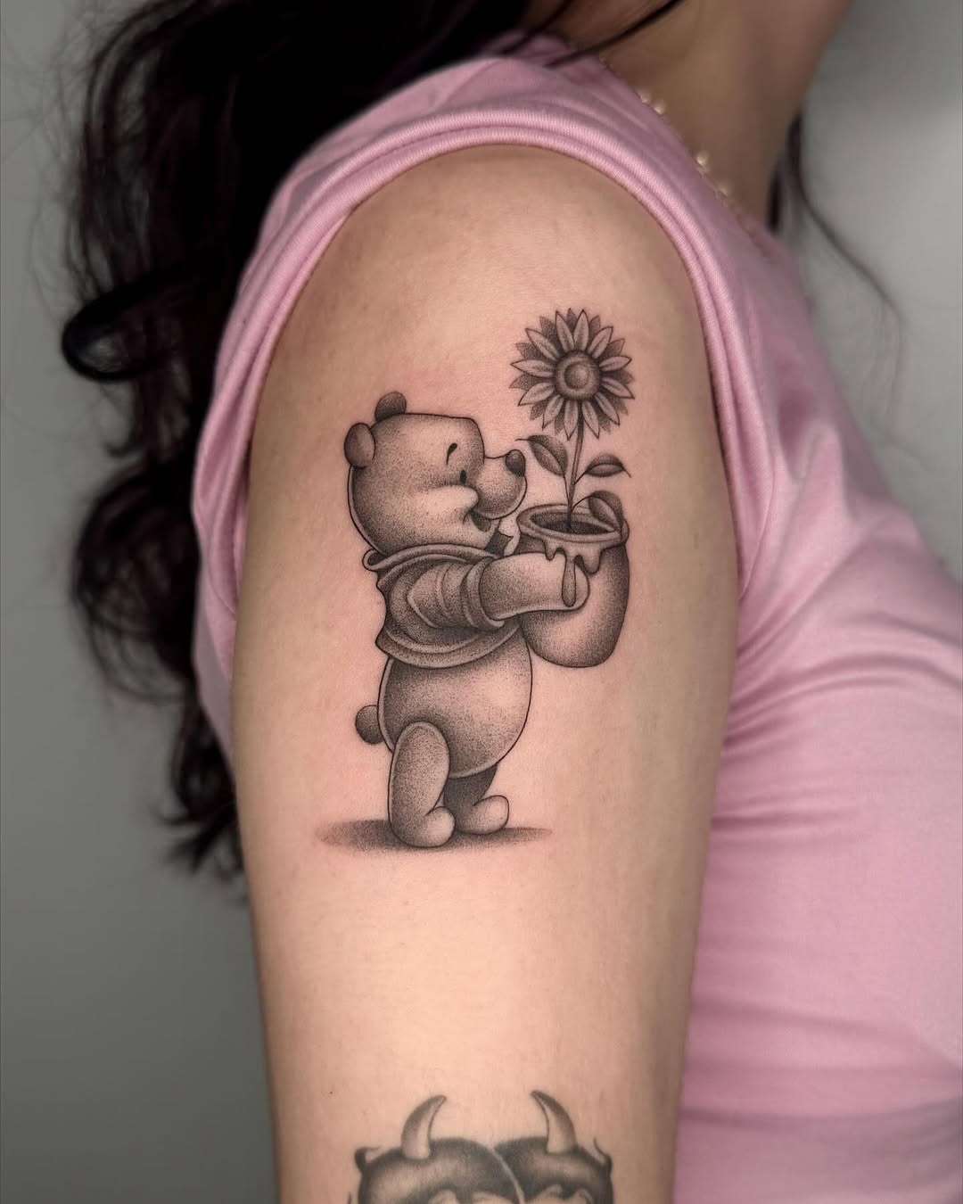 Charming Pooh with Flower Tattoo on Arm