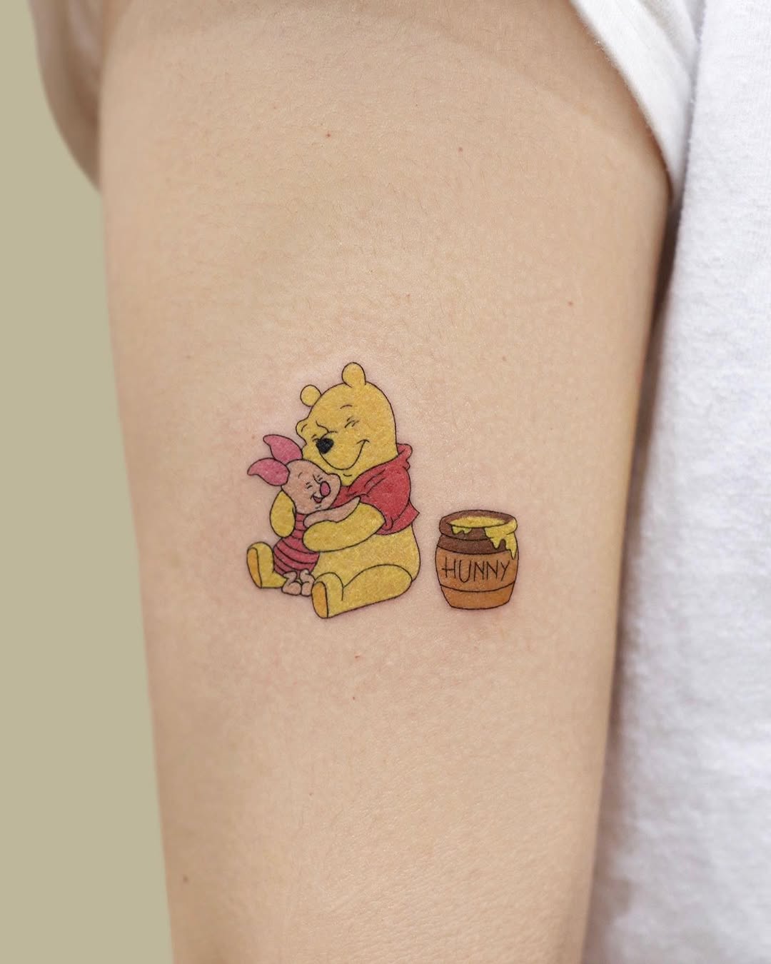 Heartwarming Pooh and Piglet Tattoo Design
