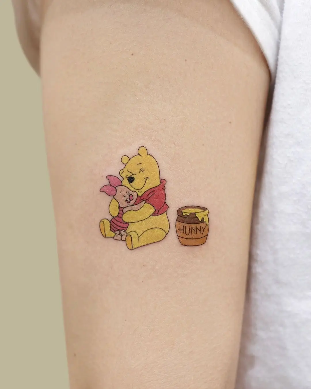 Heartwarming Pooh and Piglet Tattoo Design
