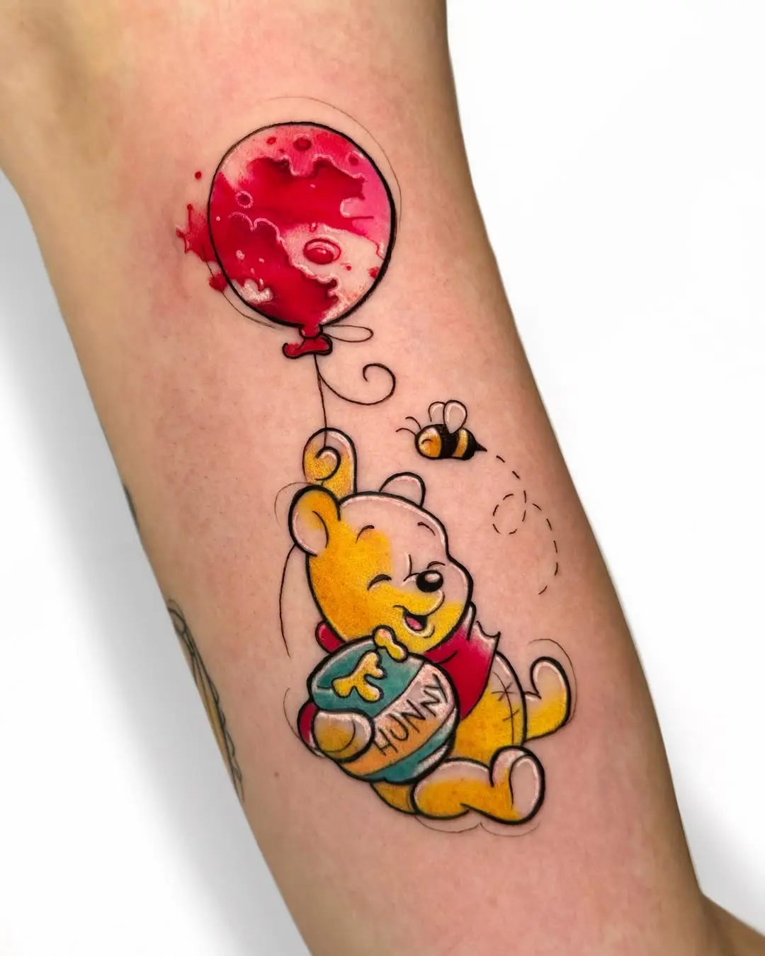 Cheerful Winnie the Pooh Tattoo with Balloon