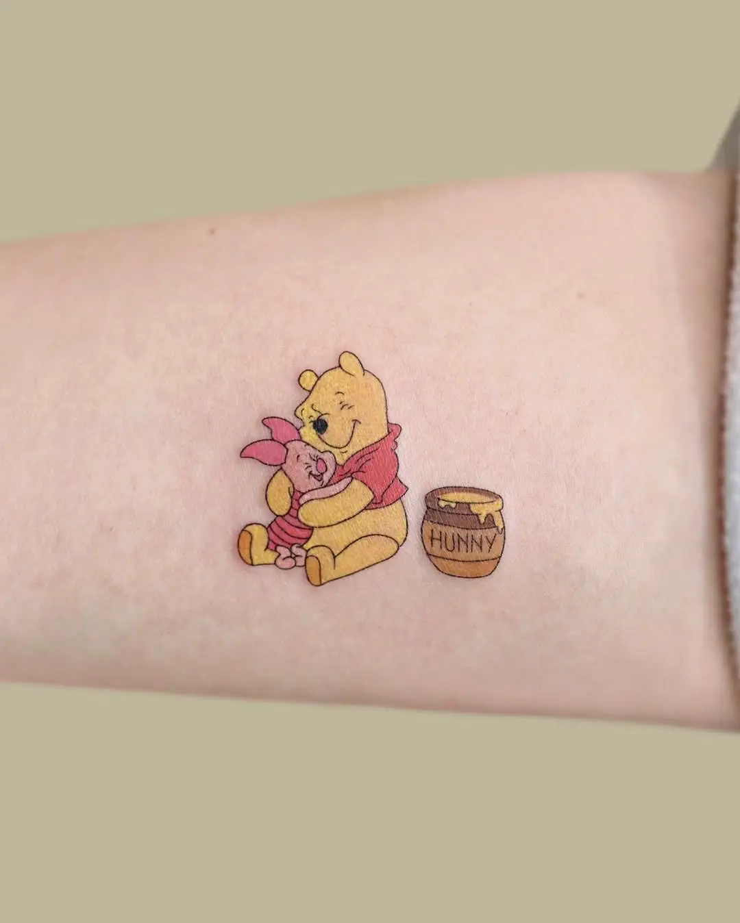 Winnie and Piglet in a sweet hug