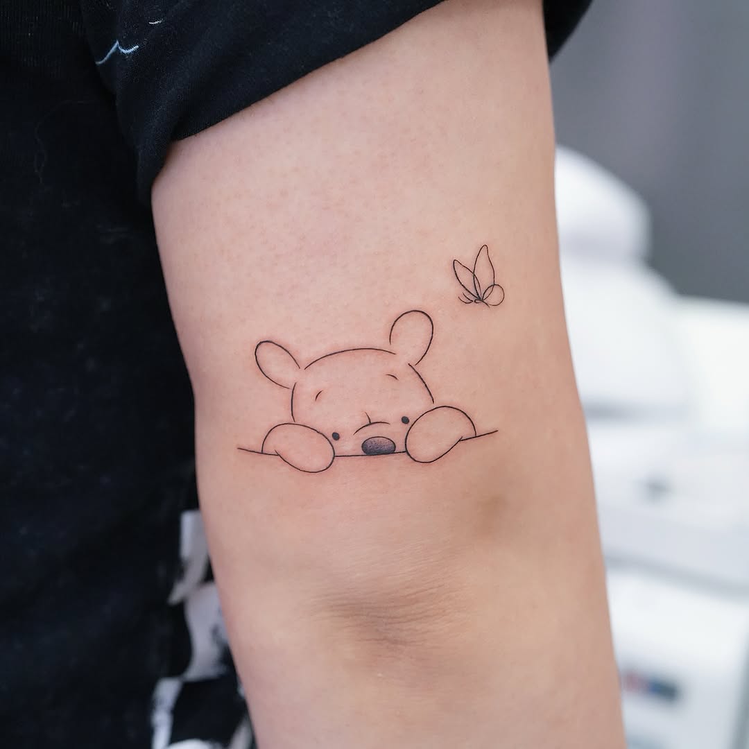 Charming Winnie the Pooh with butterfly accent