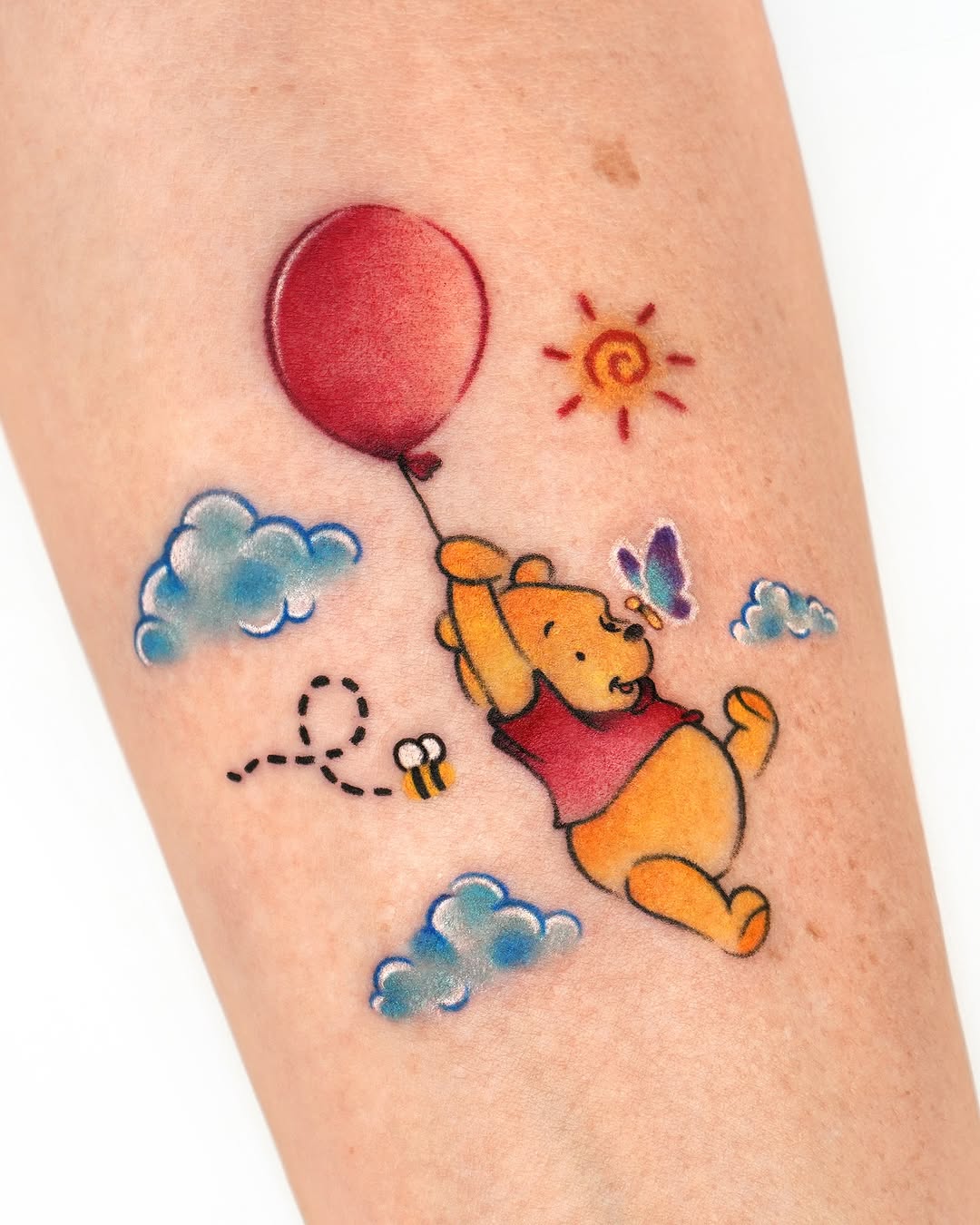 Playful Winnie the Pooh with a Red Balloon