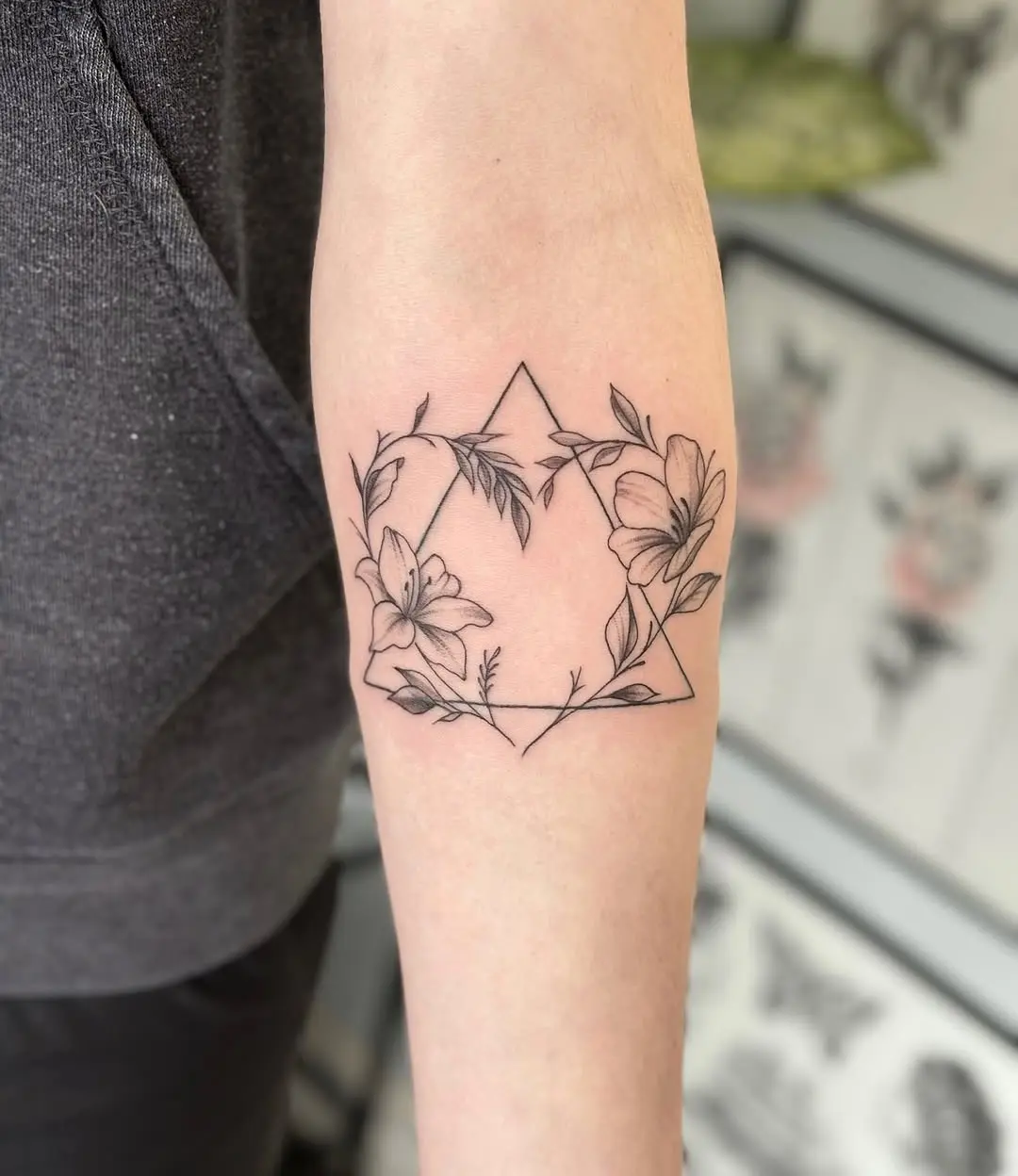 Elegant floral tattoo with geometric accents
