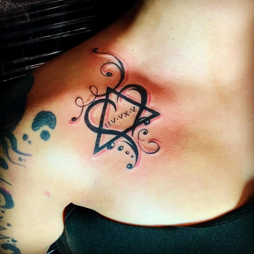 Artistic heart tattoo with meaningful date