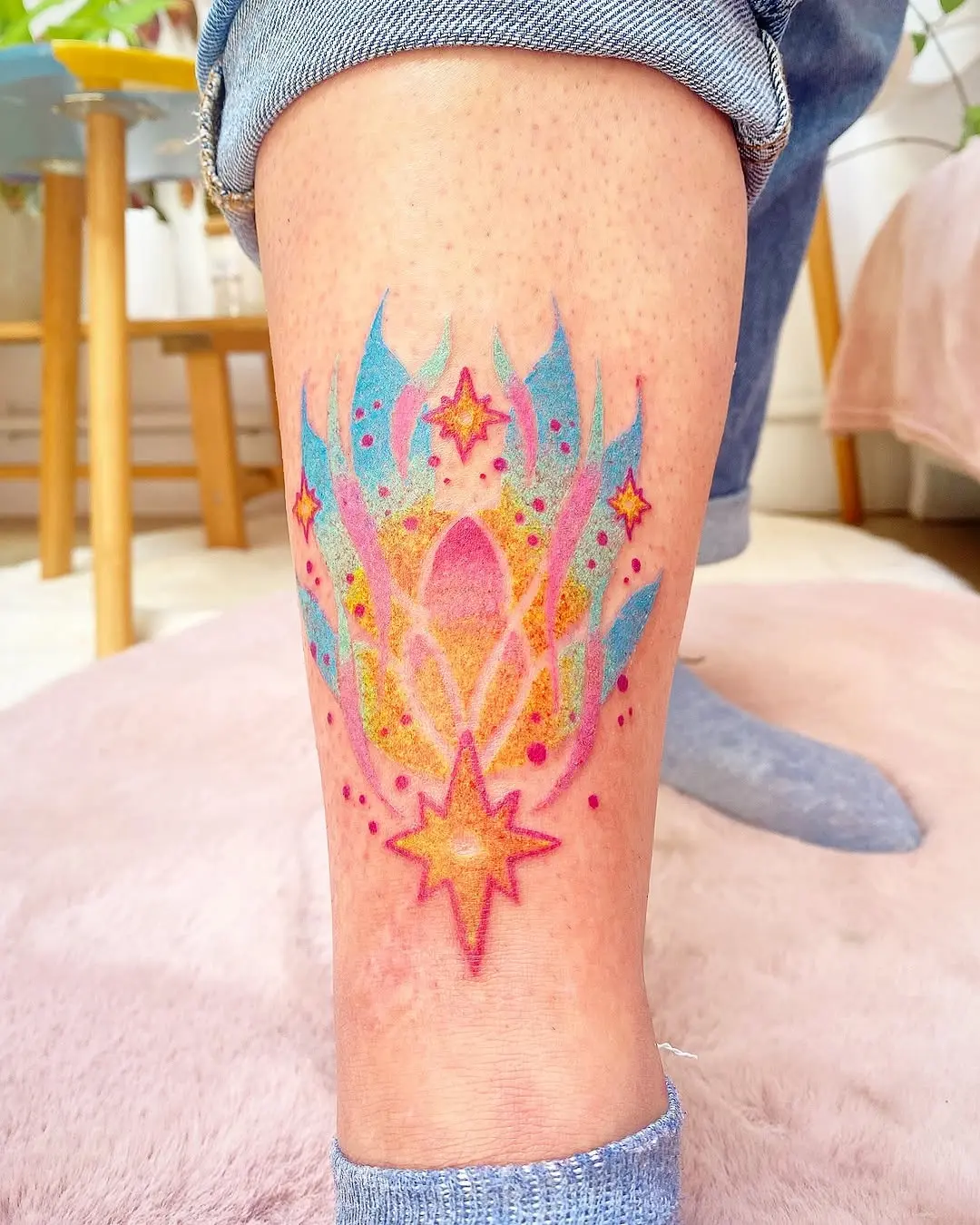 Vibrant lotus flower tattoo symbolizing love