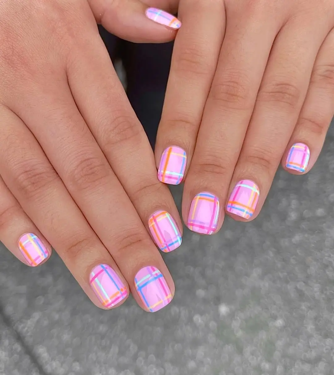 Vibrant holographic pink Barbie-inspired nail art