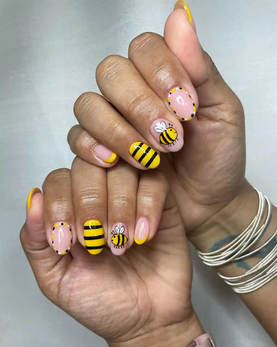 Charming bee-inspired nail art with vibrant colors