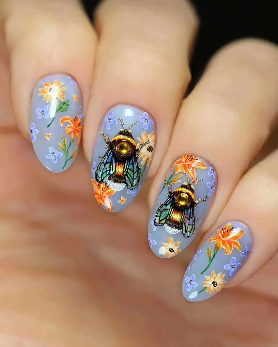 Stunning bee-themed floral nail art design