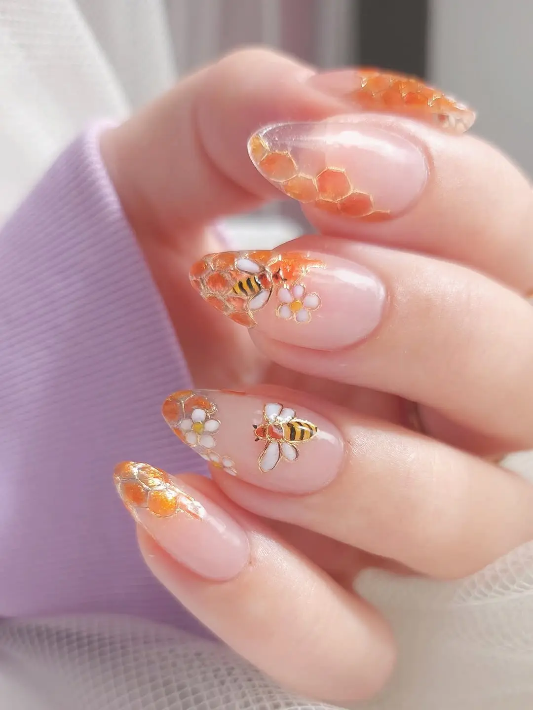 Chic bee-themed nail art for summer vibes