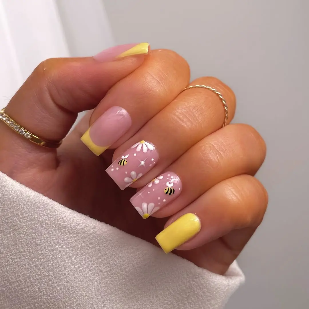 Cute bee nails with pastel color accents