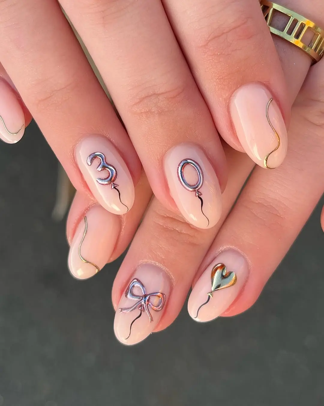 Charming birthday nails with playful embellishments