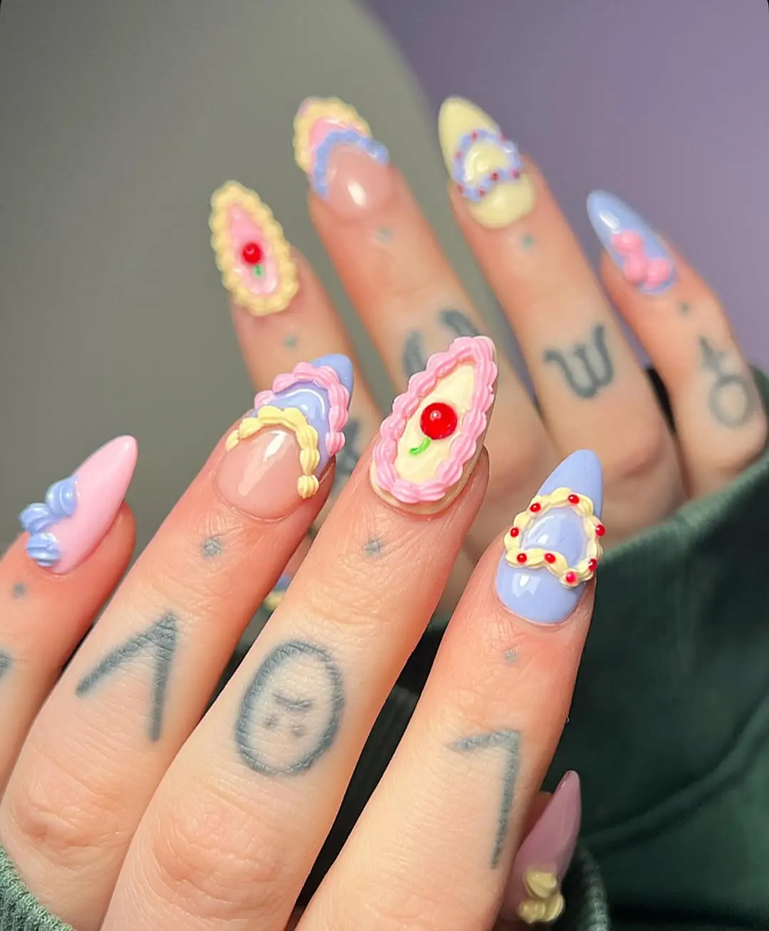 Whimsical cake-inspired birthday nail art design