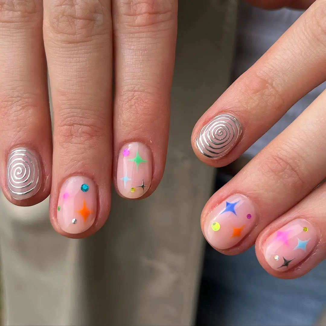Vibrant pastel birthday nail art with star accents