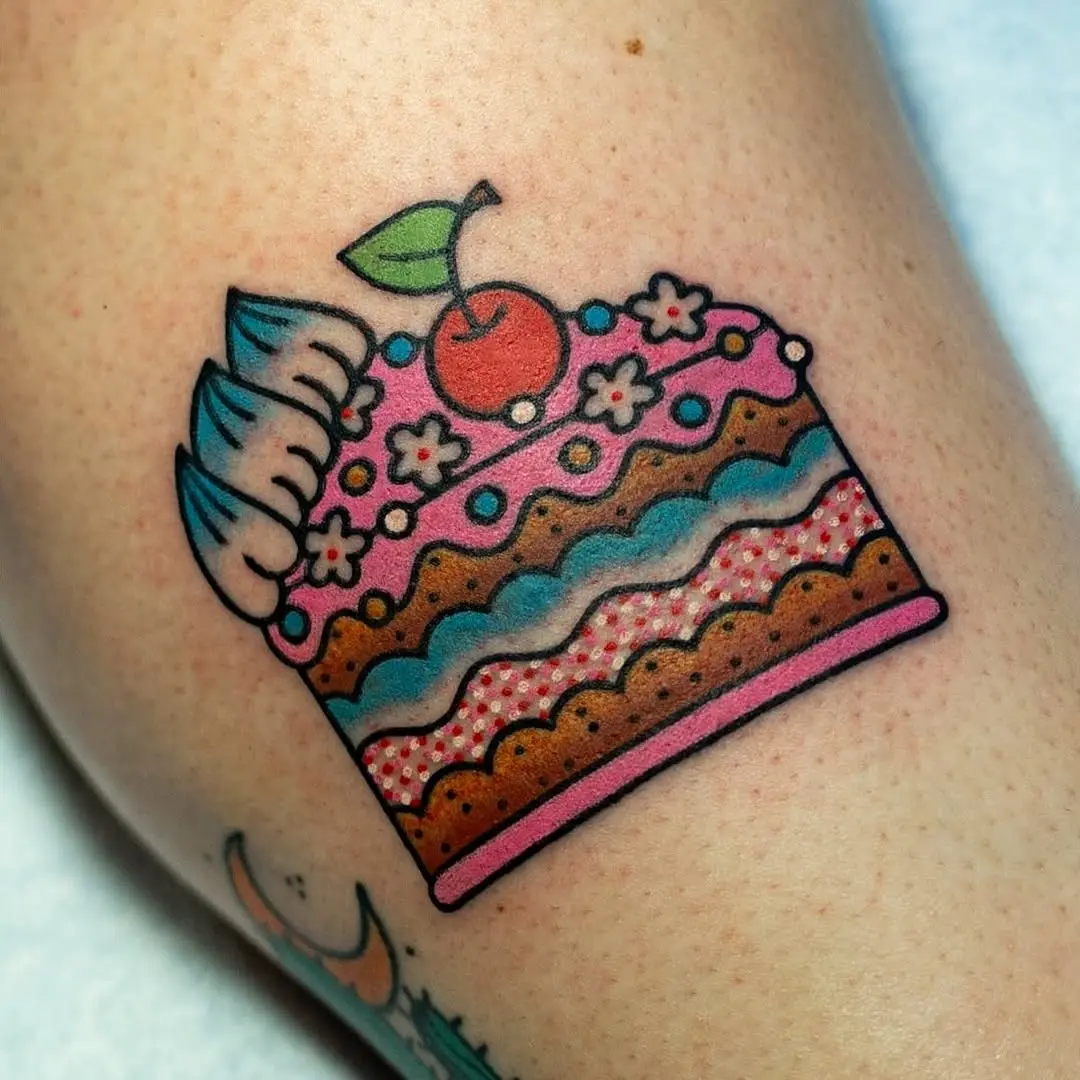Vibrant cake tattoo showcasing sweet indulgence