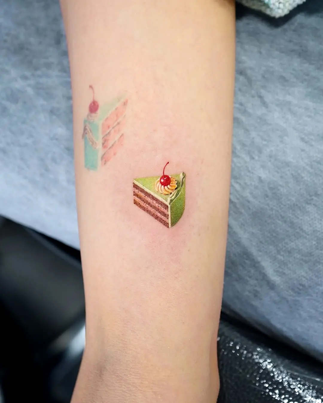 Vibrant Cake Tattoo with Cherry on Top