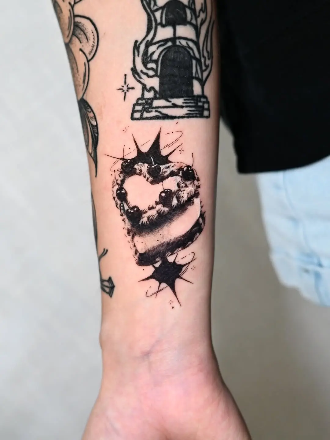 Whimsical heart-shaped cake tattoo design