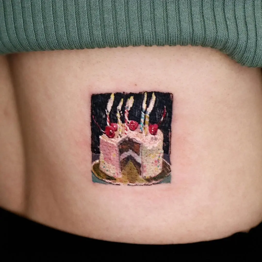 Delightful cake tattoo with colorful layers