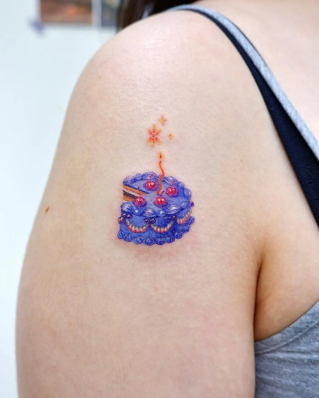 Colorful cake tattoo with whimsical details