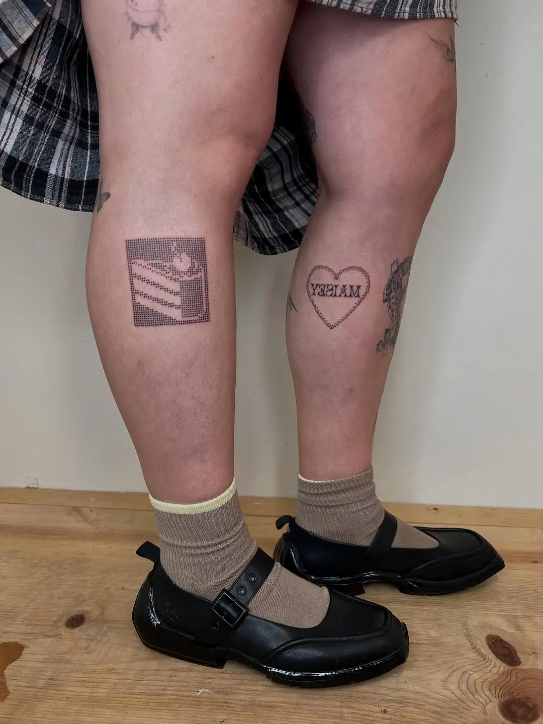 Charming cake tattoos for playful leg art