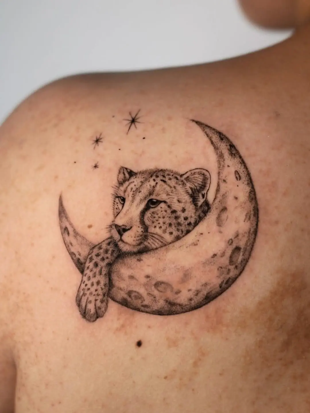 Elegant cheetah and moon tattoo design
