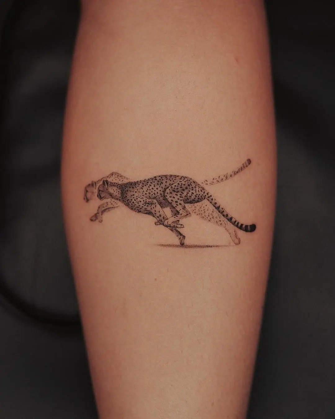 Dynamic Cheetah Tattoo in Motion