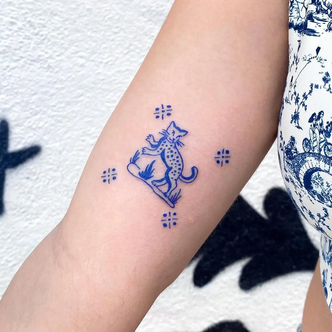 Stylish Blue Cheetah Tattoo on Arm