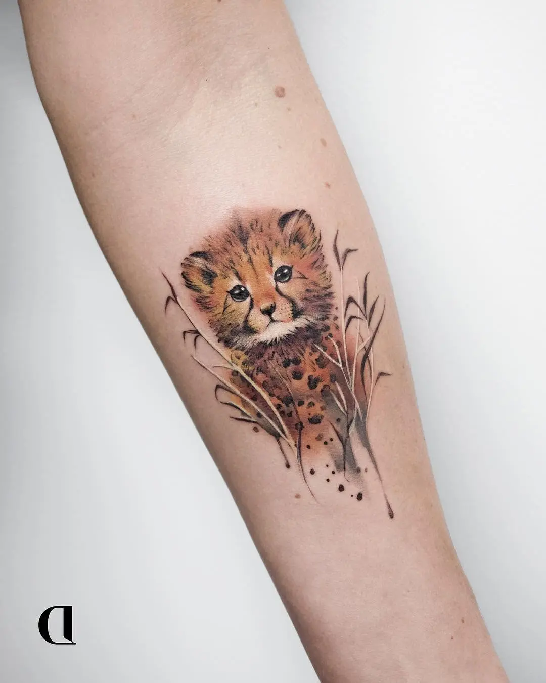 Adorable baby cheetah tattoo for a unique vibe