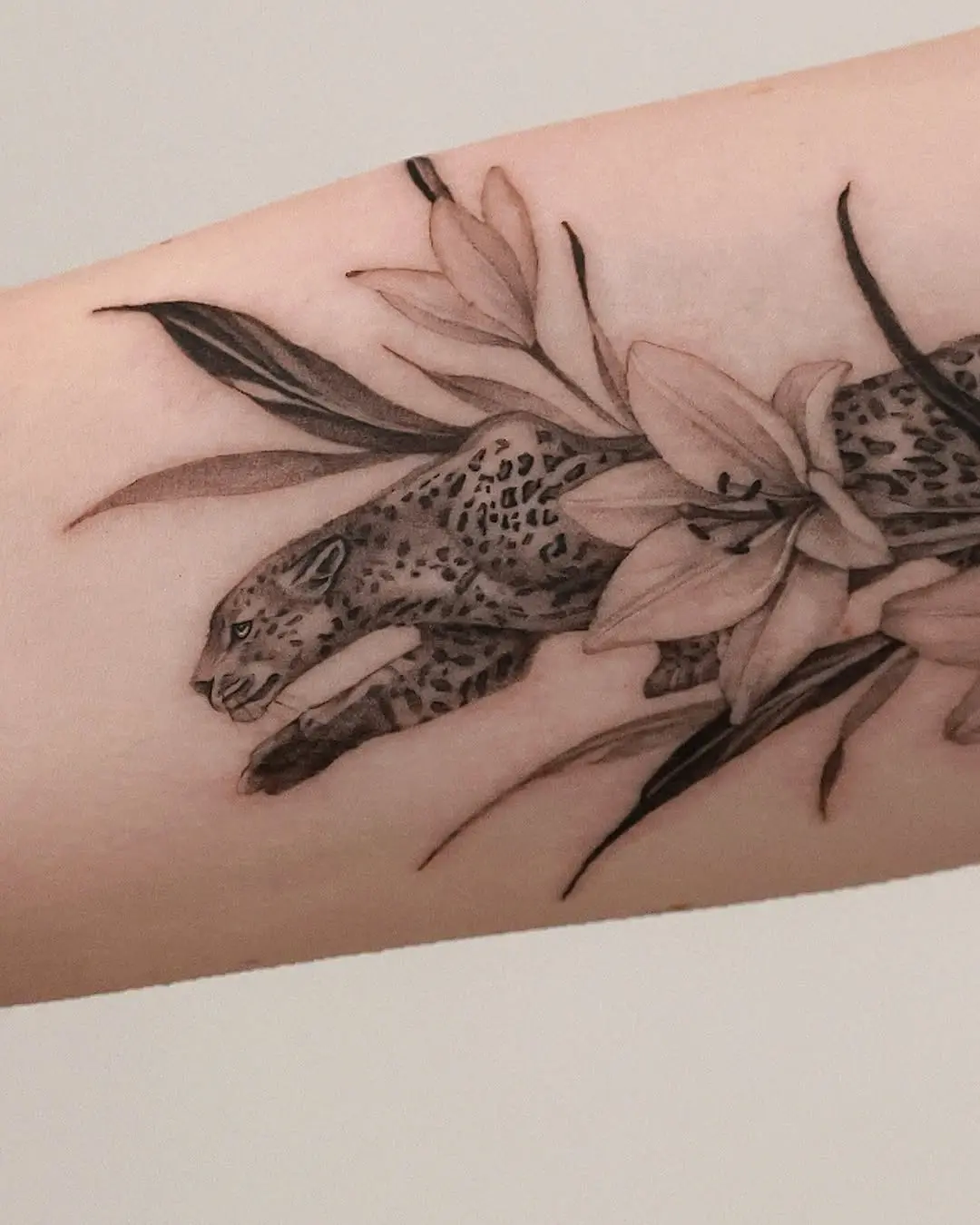 Elegant Cheetah Tattoo With Floral Elements