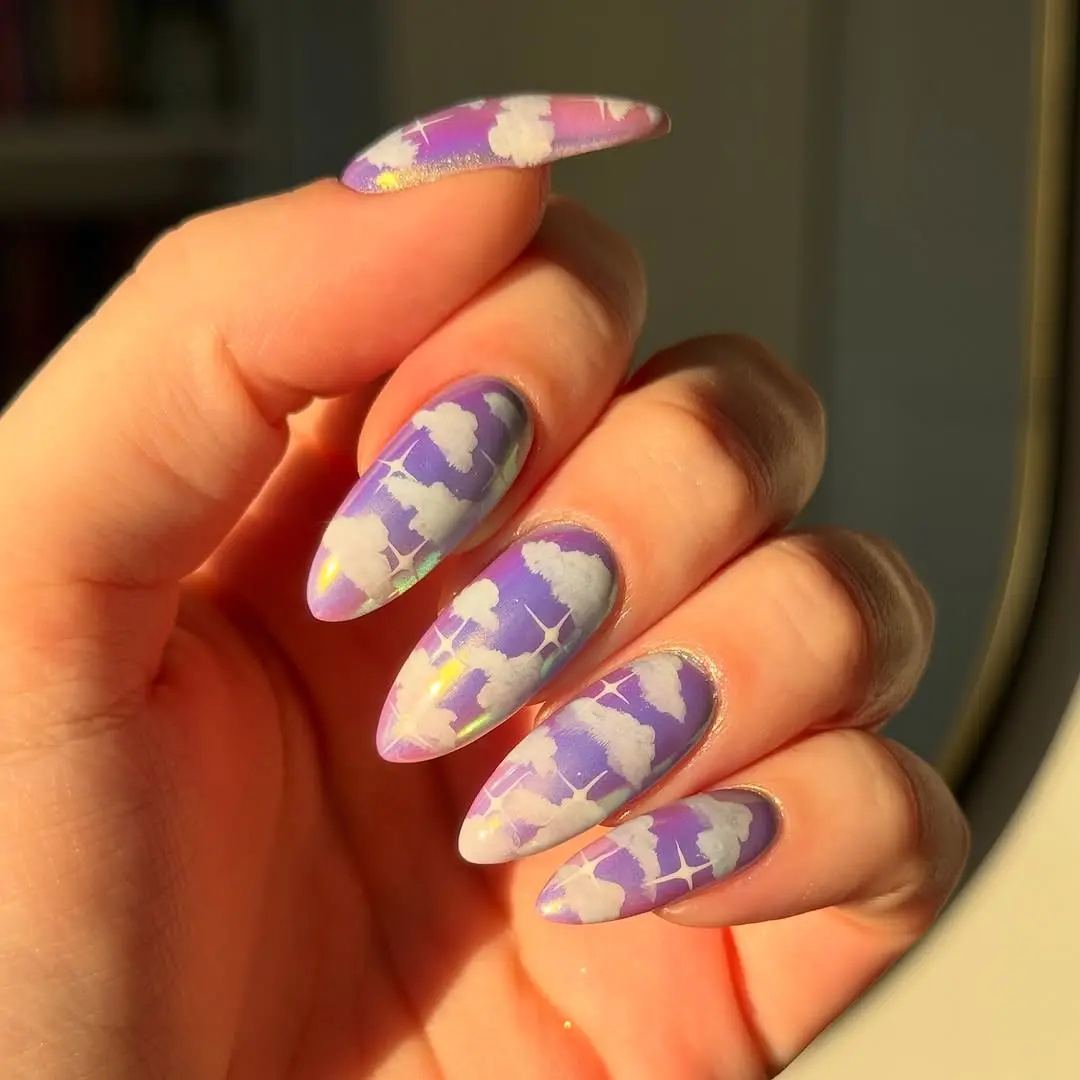 Vibrant Cloud Design on Purple-Hued Nails