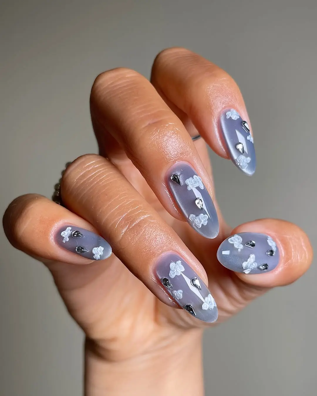 Stylish grey cloud nails with floral accents