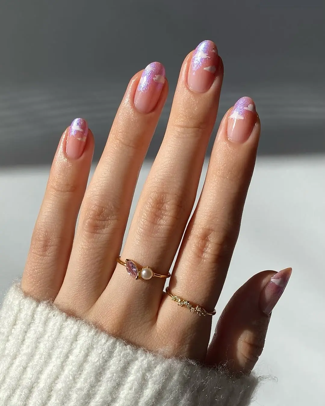 Dreamy pastel cloud nails with shimmer accents