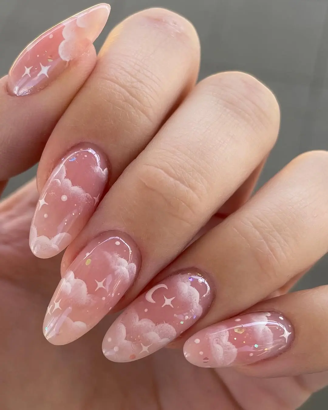 Whimsical cloud-themed nail art design