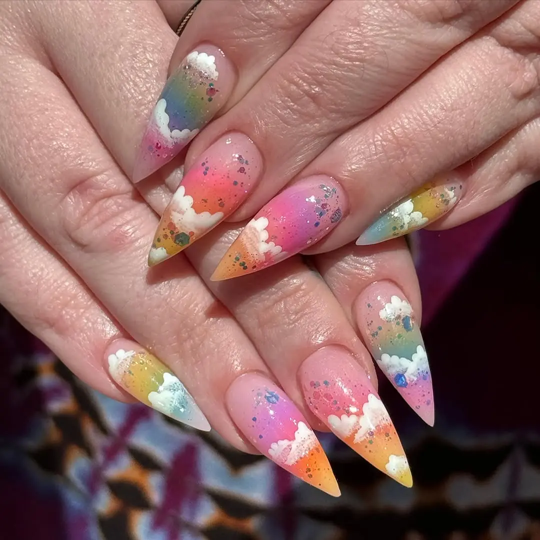 Vibrant rainbow cloud nail art inspiration