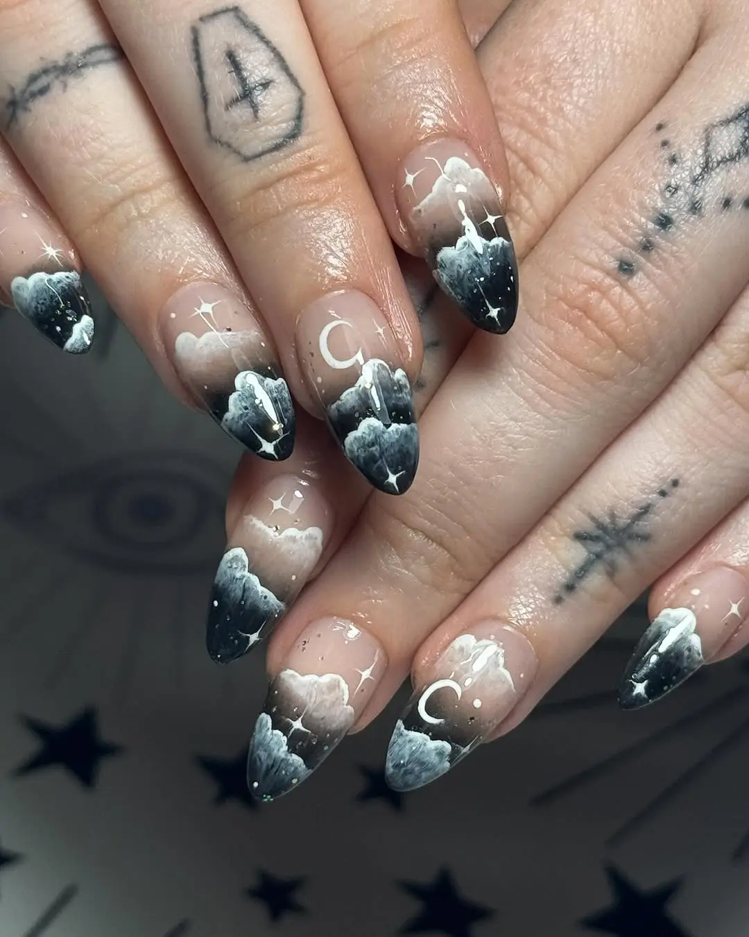 Elegant cloud-inspired nails with moon accents