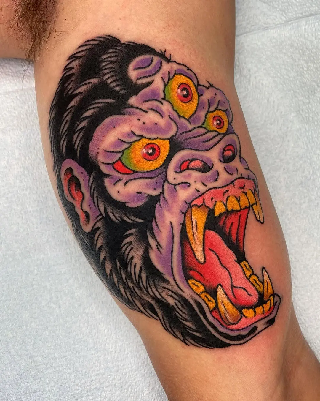 Vibrant gorilla tattoo with fierce expression