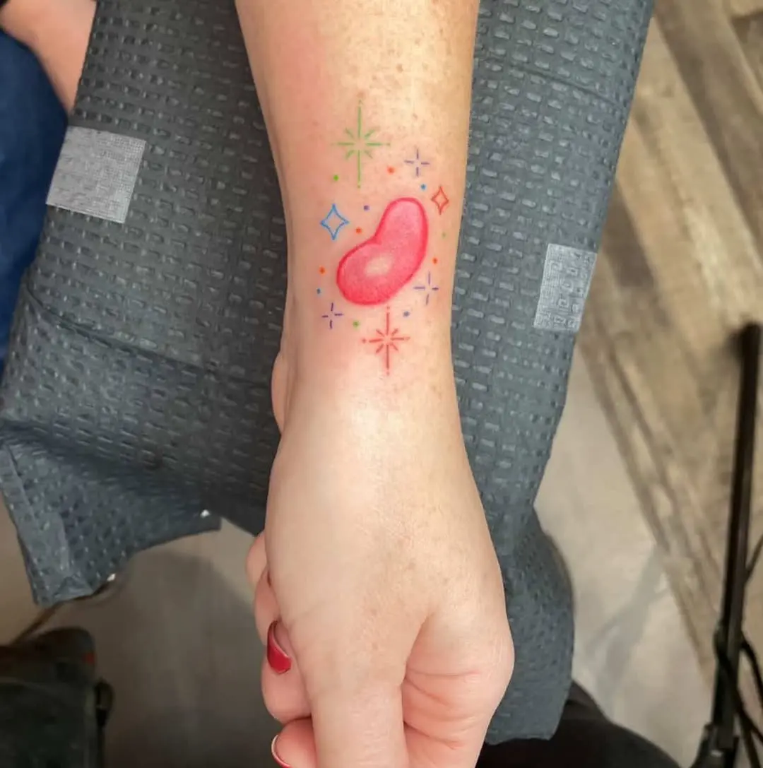 Colorful jelly bean tattoo exuding playful vibes