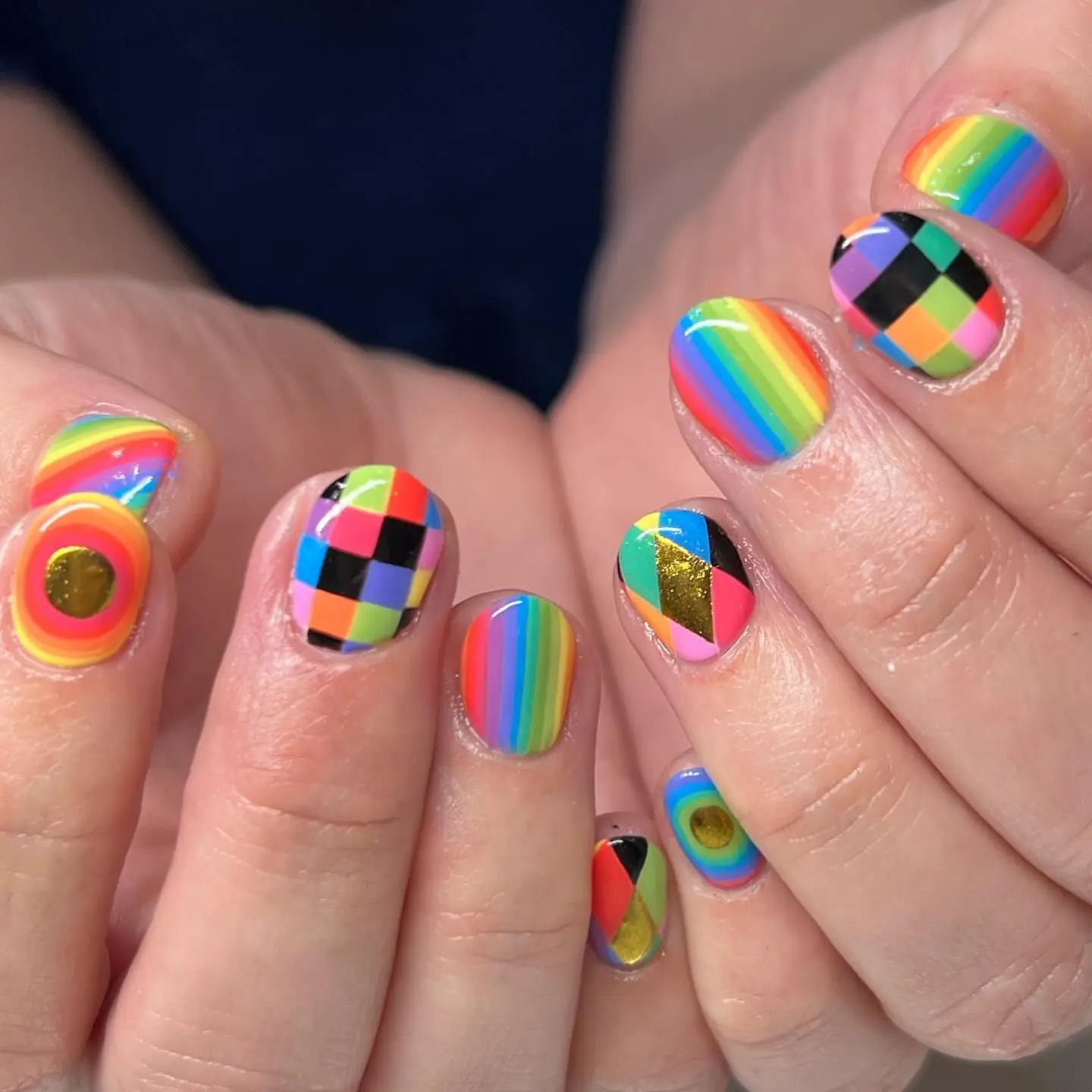 Vibrant rainbow checkered nail art design